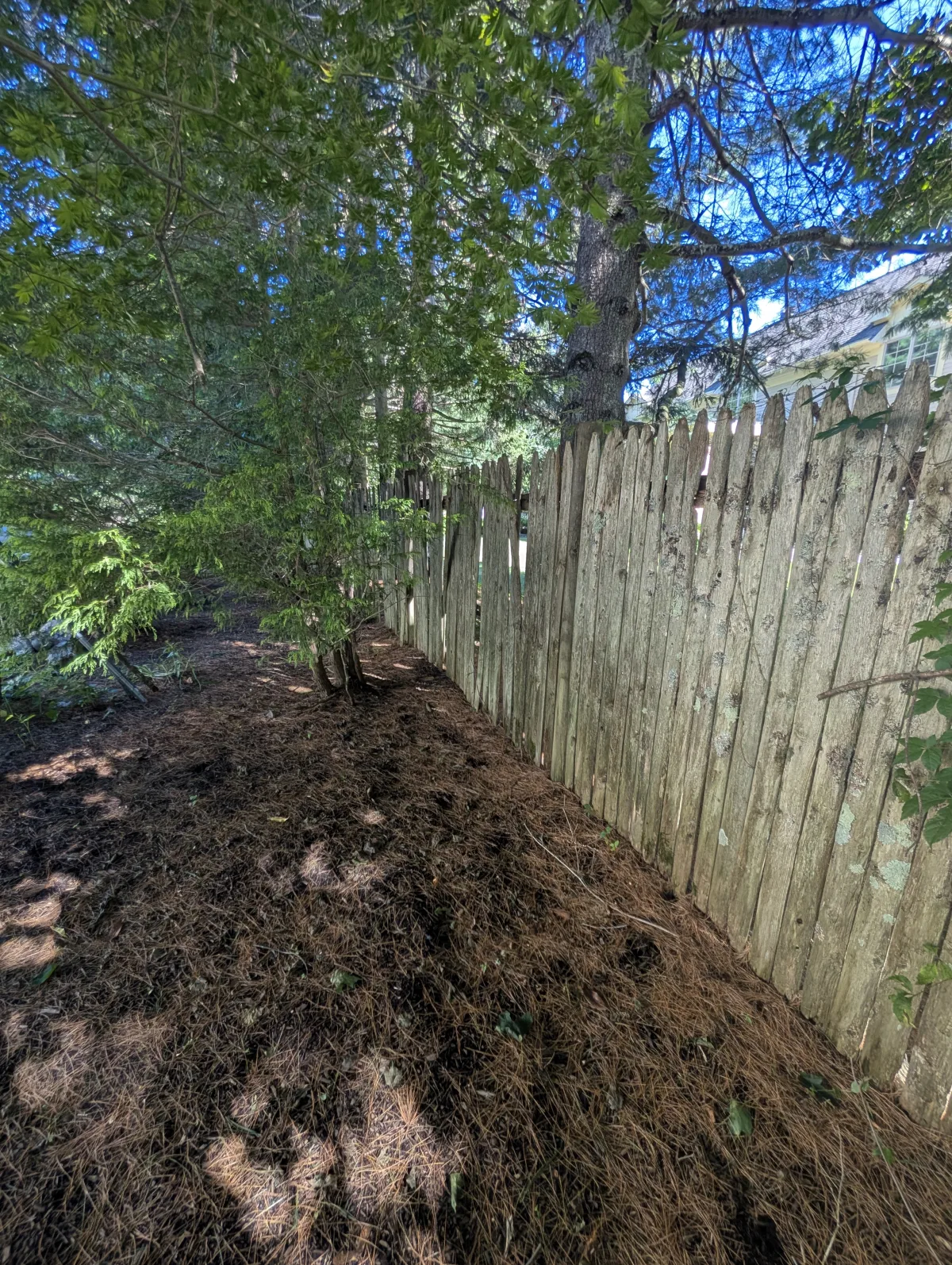 Wood fence installation project in Sudbury Massachusetts with plumb posts and clean lines