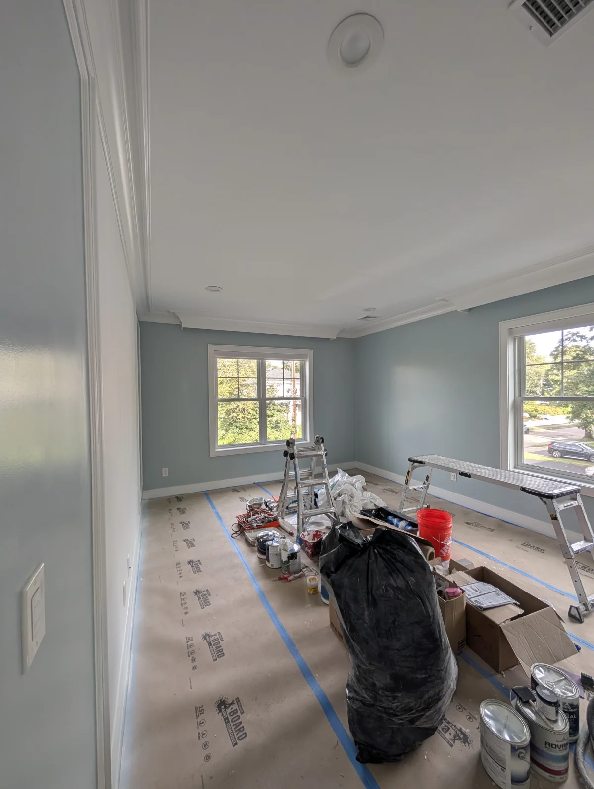Interior house painting project in Wellesley Massachusetts with clean cut lines on walls and trim